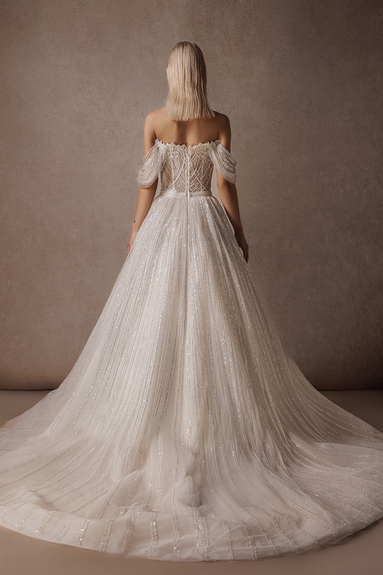 Off-the-Shoulder Princess Wedding Gown with Embroidered Bodice and Sequined Skirt