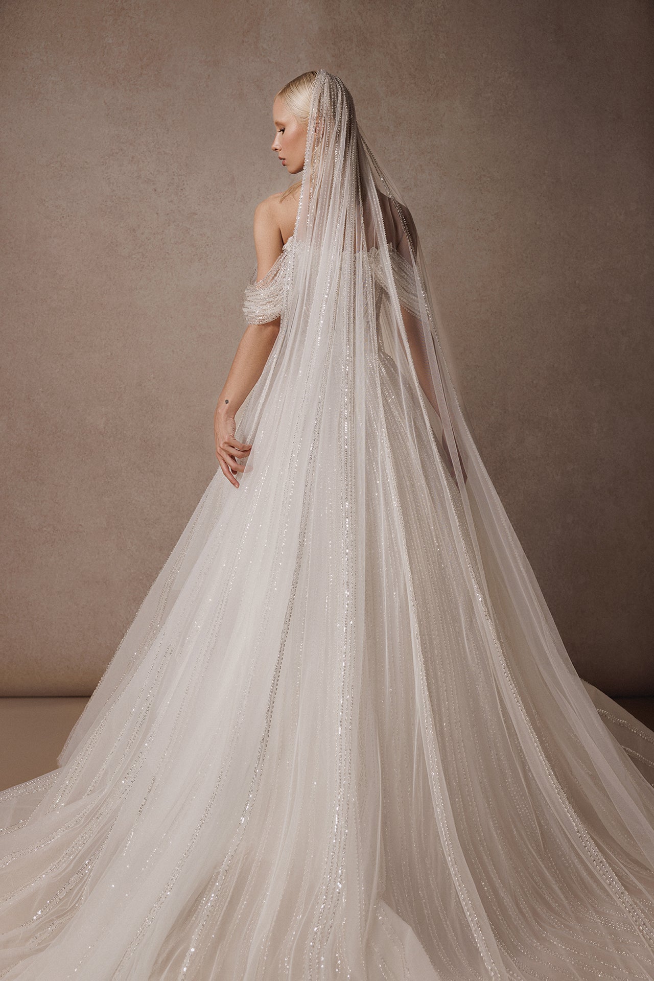 Off-the-Shoulder Princess Wedding Gown with Embroidered Bodice and Sequined Skirt