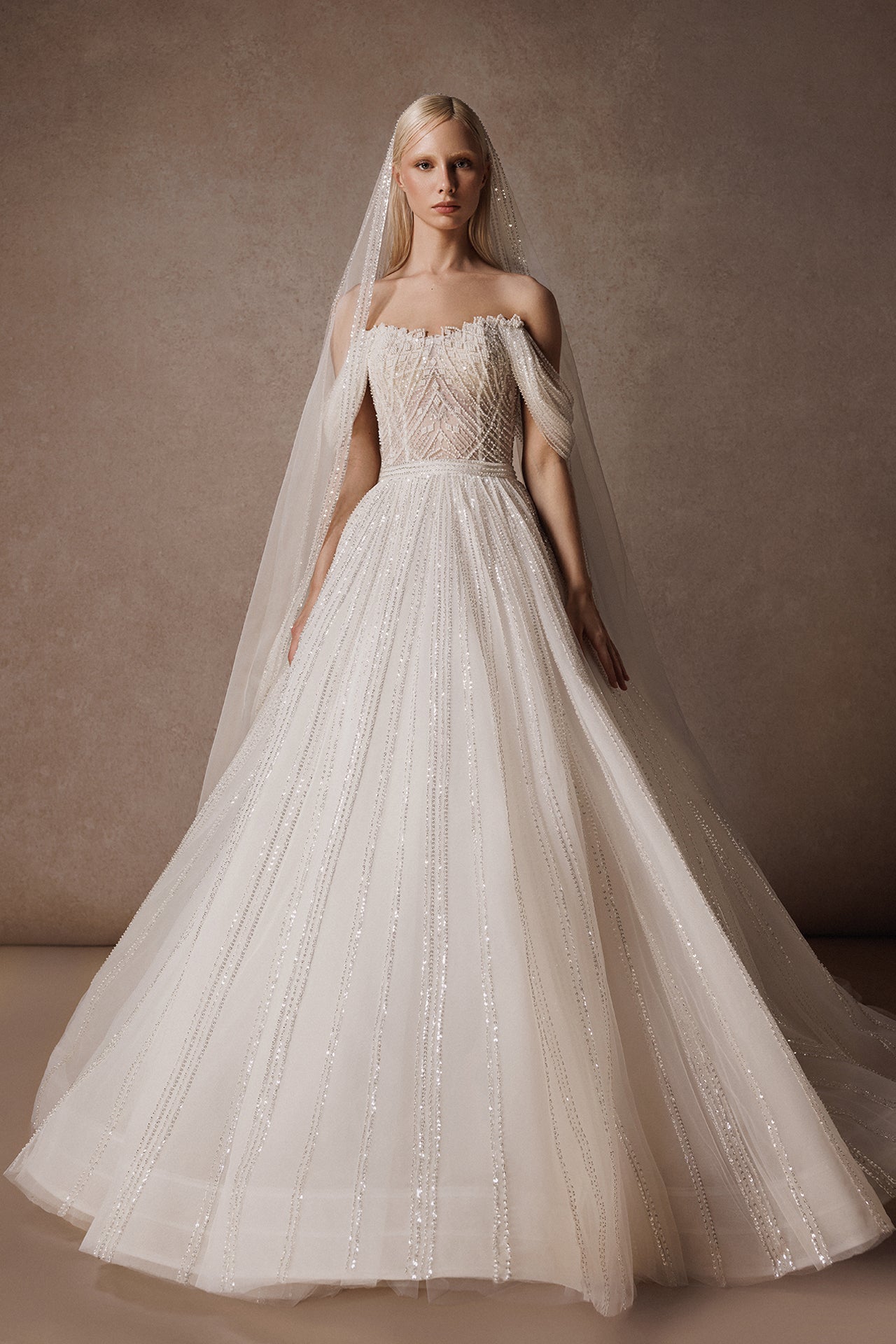 Off-the-Shoulder Princess Wedding Gown with Embroidered Bodice and Sequined Skirt