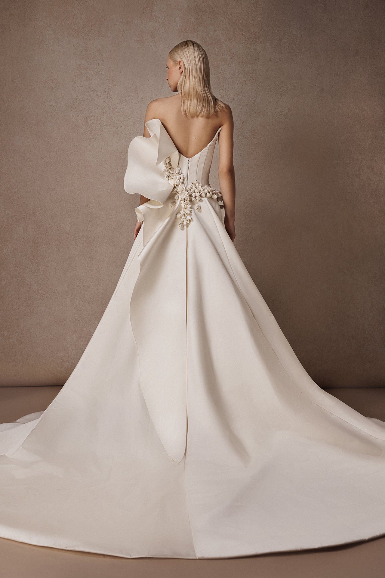 Strapless Wedding Gown with Flower-Adorned Corset and Draped Overskirt