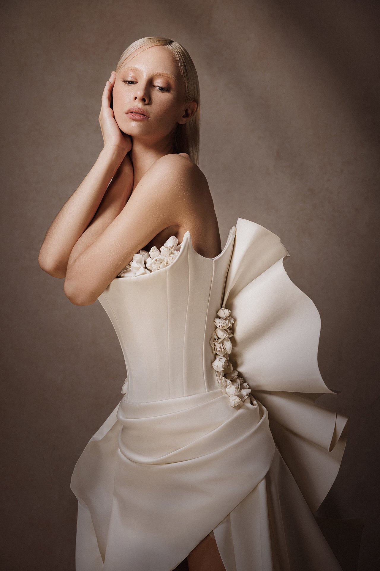 Strapless Wedding Gown with Flower-Adorned Corset and Draped Overskirt