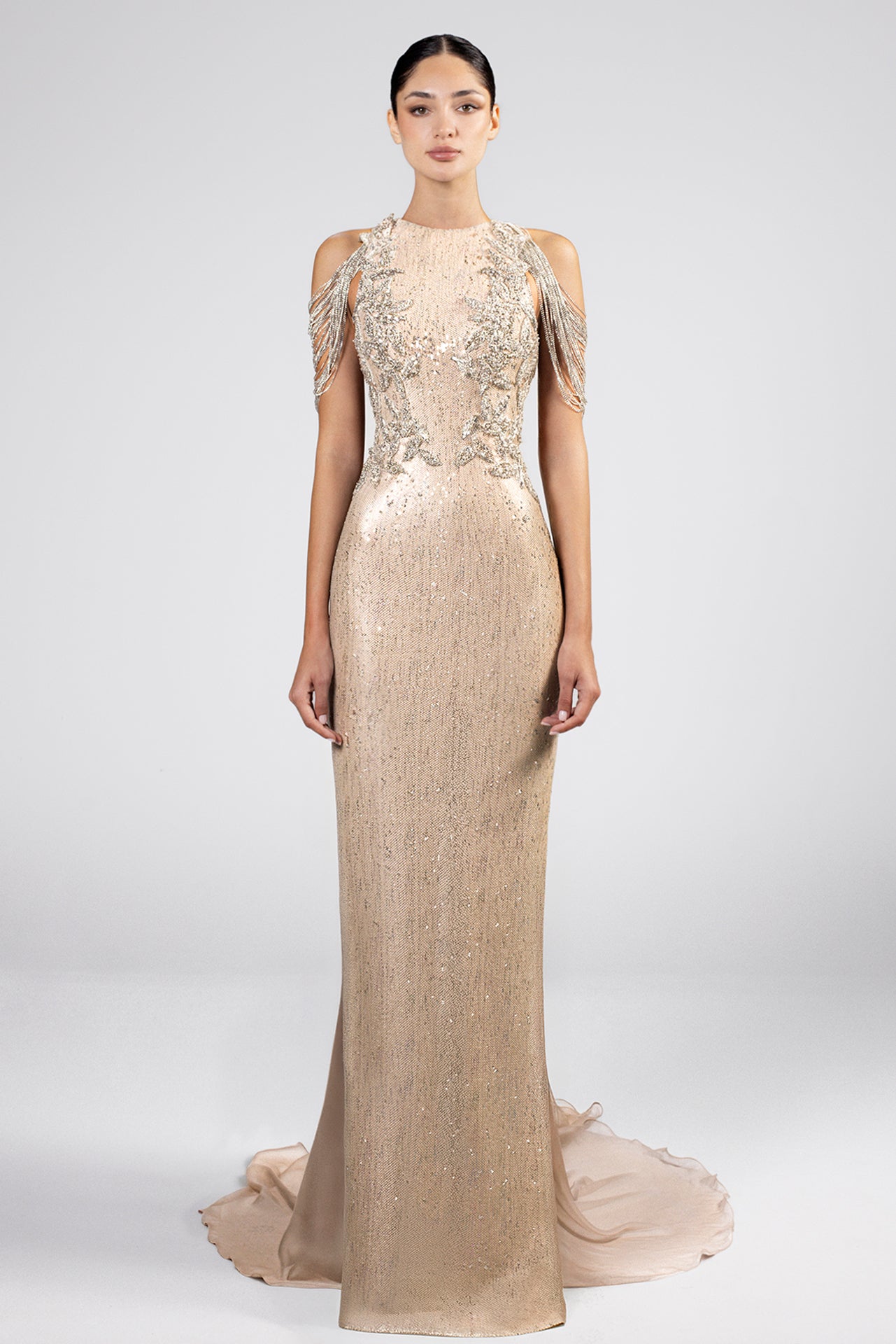 Load and play video in Gallery viewer, Greige floor-length dress, sequin bodice, hand-embroidered Swarovski, cold shoulders, fringe details, fitted silhouette, chiffon cape train, shoulder button closure.