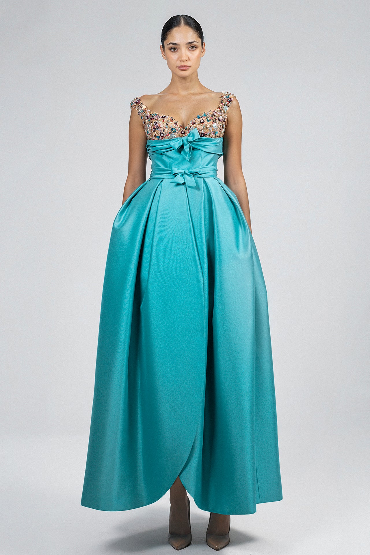 Load and play video in Gallery viewer, "Turquoise cadi dress, box pleat skirt, wrap detail, multicolor crystal embroidery, sweetheart neckline, shoulder straps, bow waistband, center back zipper, tea-length hemline.
