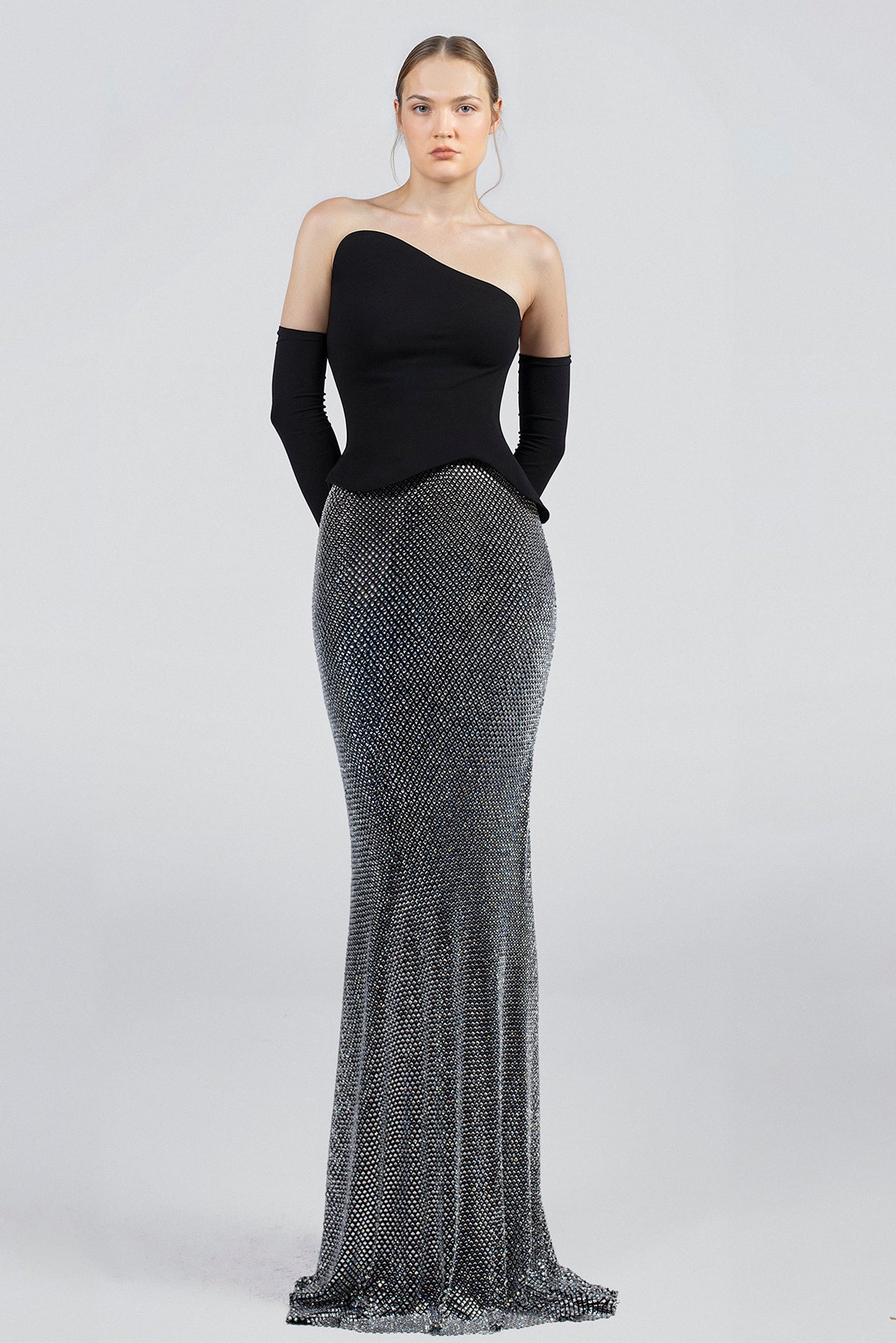 Load and play video in Gallery viewer, Black crepe top, strapless neckline, detached gloves, peplum waist, silver crystal mesh skirt, trumpet silhouette, sweep train.