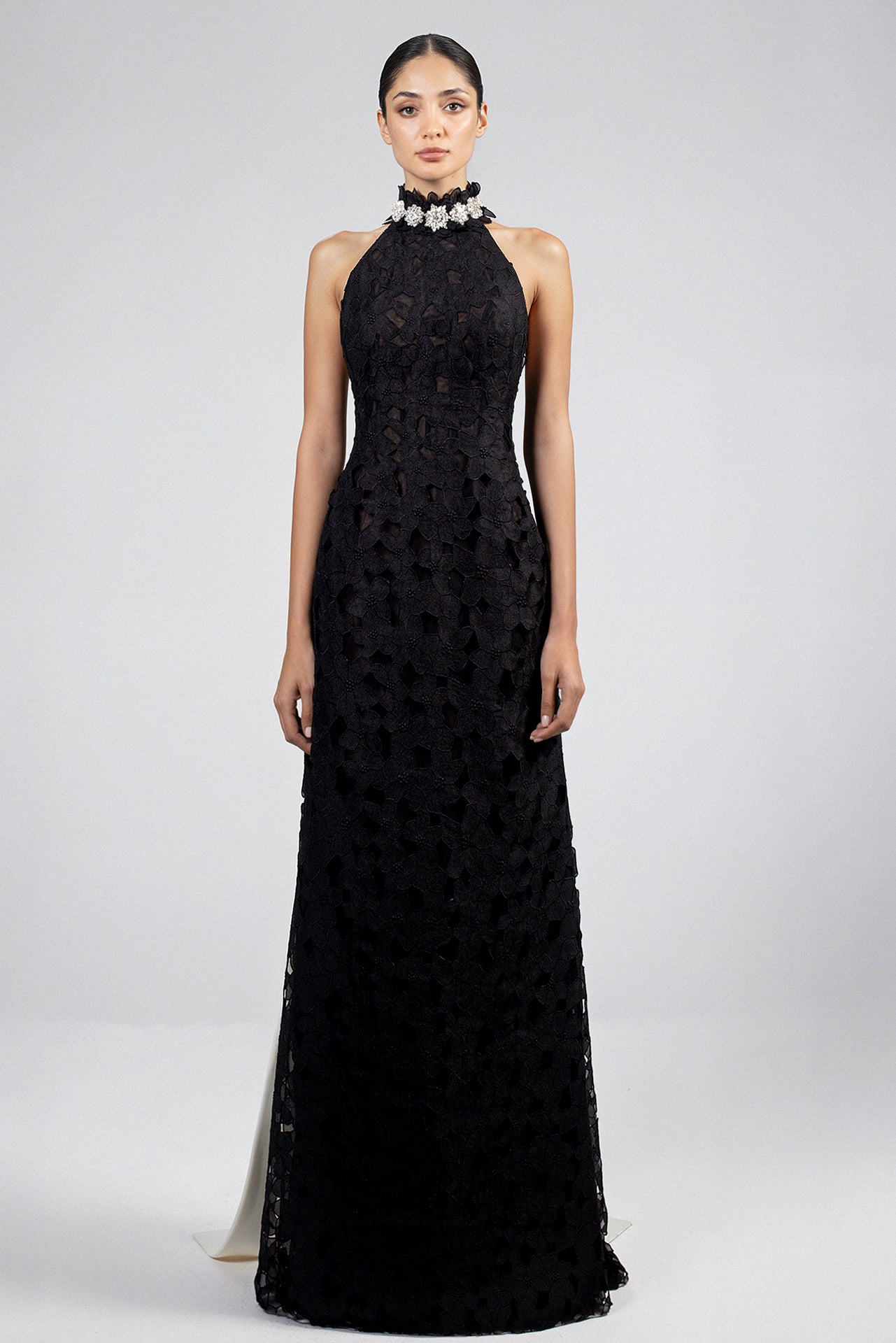 Load and play video in Gallery viewer, Floor-length dress, halter neckline, crystal embellishments, fitted geometric lace bodice, white crepe cape with crystal hem, black overlayer, A-line silhouette.