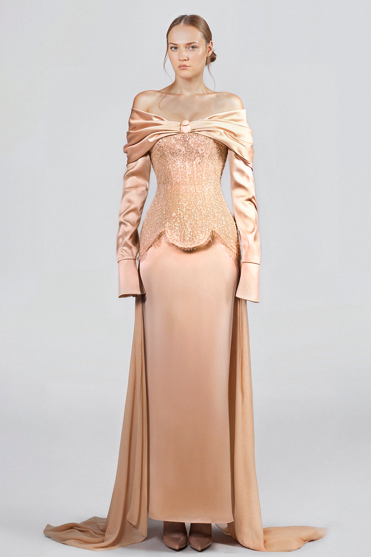 Load and play video in Gallery viewer, Hand-embroidered lace bodice, off-shoulder neckline, long sleeves, fitted skirt with back slit, chiffon train attached at waist.