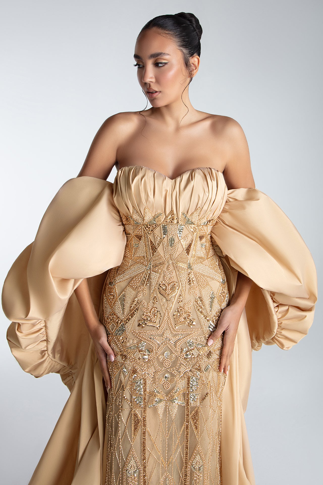 Strapless Gown With Draped Bodice And Sculptural Cape