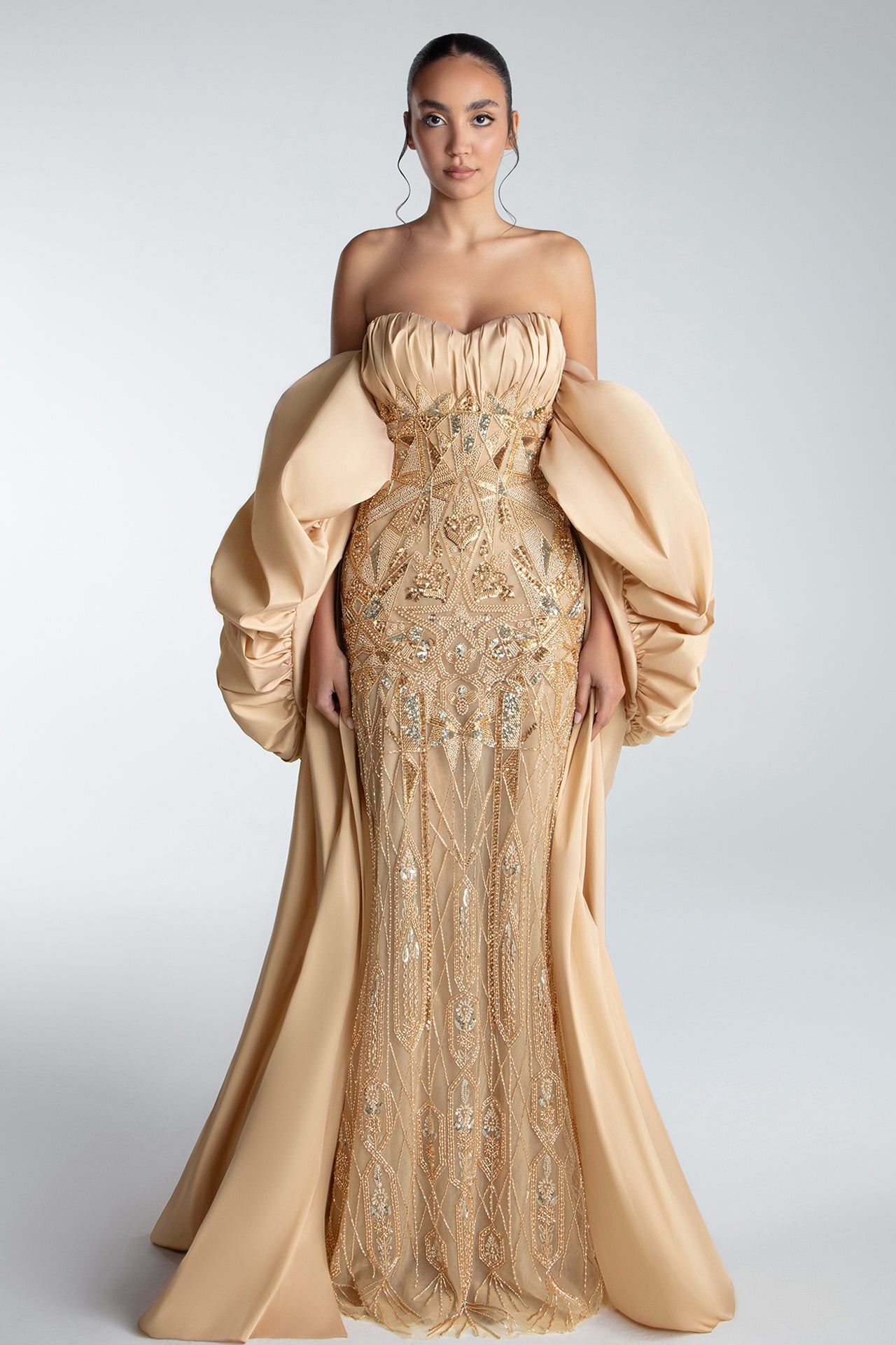 Strapless Gown With Draped Bodice And Sculptural Cape