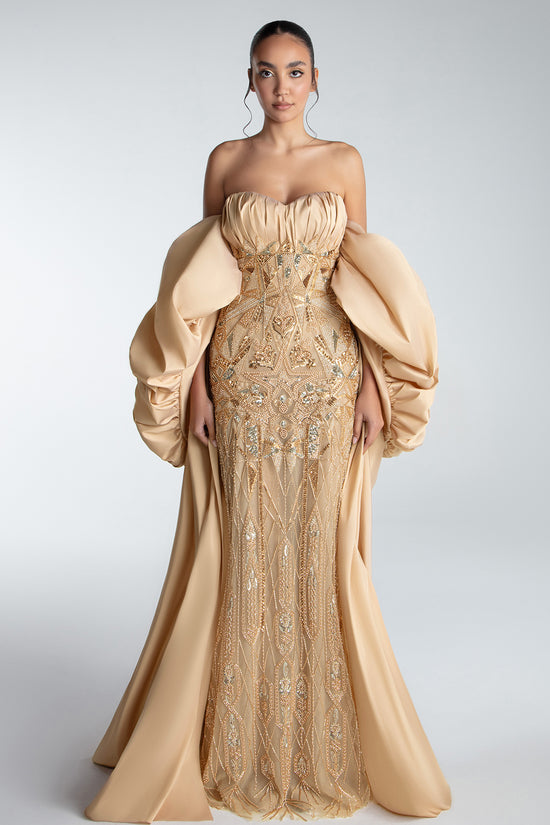 Strapless Gown With Draped Bodice And Sculptural Cape