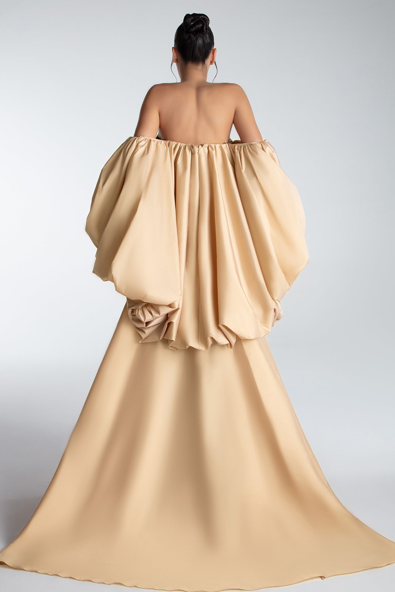 Strapless Gown With Draped Bodice And Sculptural Cape